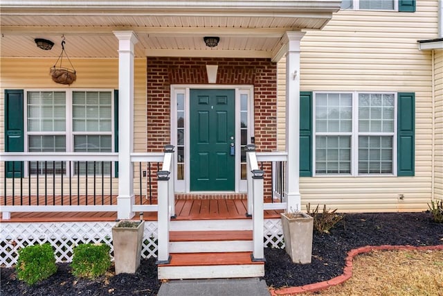 doorway to property with a porch