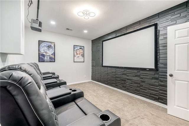 home theater room featuring light colored carpet