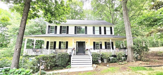 colonial-style house featuring a porch