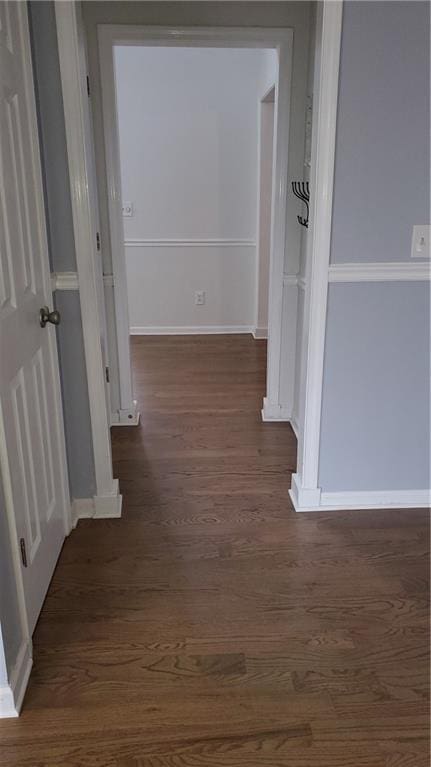 hall featuring dark wood-type flooring