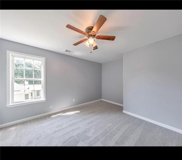 unfurnished room with carpet floors and ceiling fan