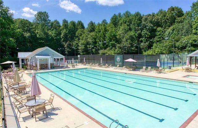 view of swimming pool featuring a patio area