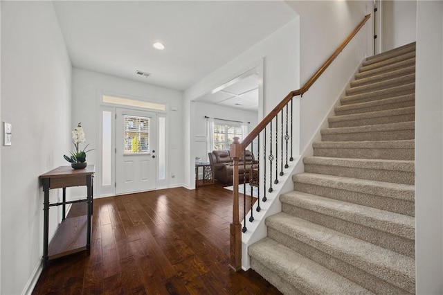 entryway with stairway, baseboards, visible vents, recessed lighting, and dark wood-style flooring