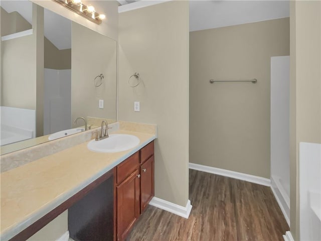 bathroom with vanity and hardwood / wood-style floors