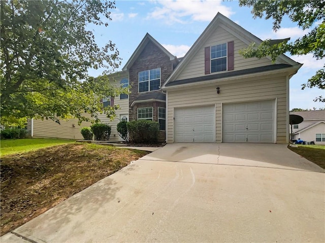 view of front of home with concrete driveway