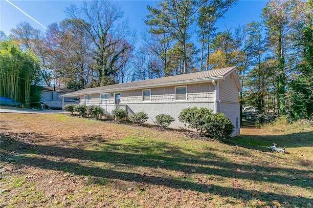 8775 Lee Rd, Lithia Springs, GA 30122 - view of side of property with a yard