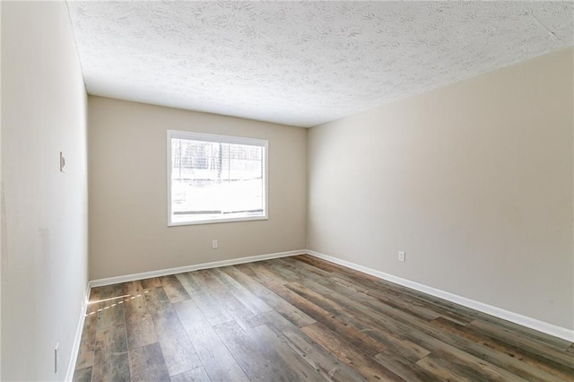 8775 Lee Rd, Lithia Springs, GA 30122 - spare room with a textured ceiling and dark hardwood / wood-style flooring