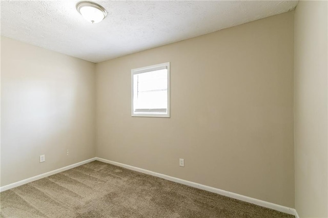 8775 Lee Rd, Lithia Springs, GA 30122 - carpeted spare room featuring a textured ceiling
