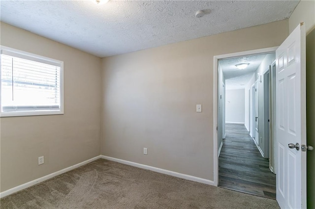 8775 Lee Rd, Lithia Springs, GA 30122 - empty room with carpet flooring and a textured ceiling