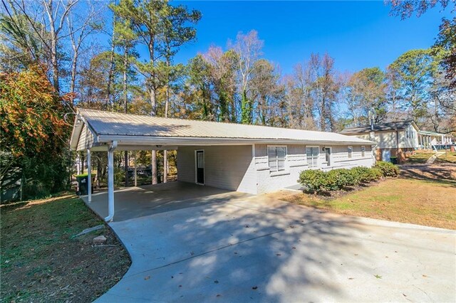 8775 Lee Rd, Lithia Springs, GA 30122 - view of front of home with a front lawn and a carport