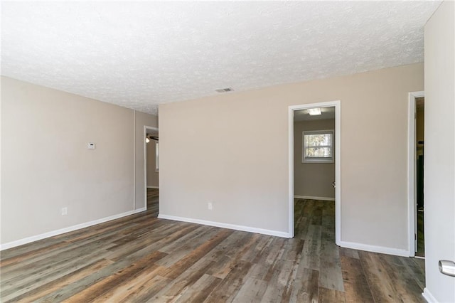 8775 Lee Rd, Lithia Springs, GA 30122 - unfurnished room featuring dark hardwood / wood-style flooring and a textured ceiling
