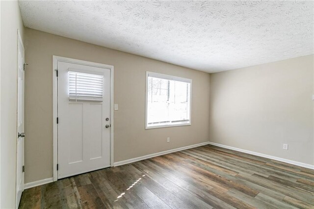 8775 Lee Rd, Lithia Springs, GA 30122 - entrance foyer featuring dark hardwood / wood-style flooring and a textured ceiling