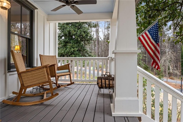 wooden deck featuring ceiling fan and a porch