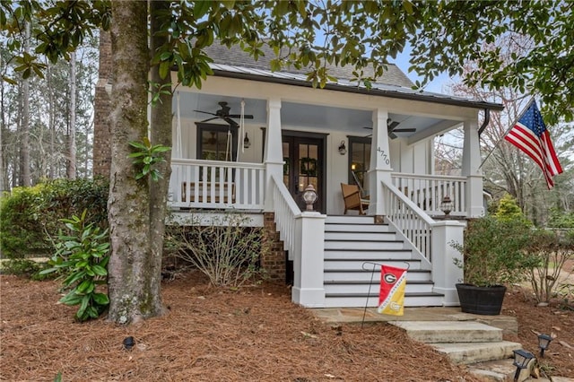 view of front of home with stairs, a ceiling fan, roof with shingles, and a porch