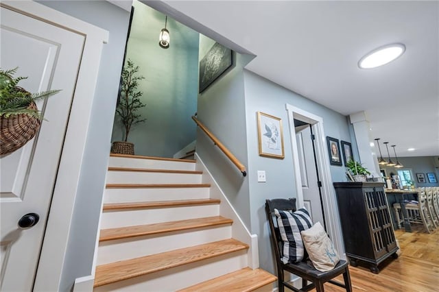 staircase featuring wood finished floors