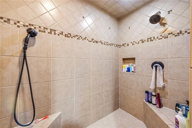 bathroom with tiled shower