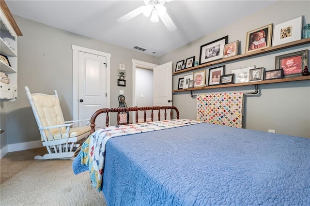 bedroom with visible vents, carpet flooring, baseboards, and ceiling fan