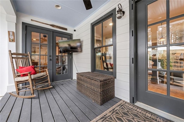 doorway to property featuring french doors and covered porch