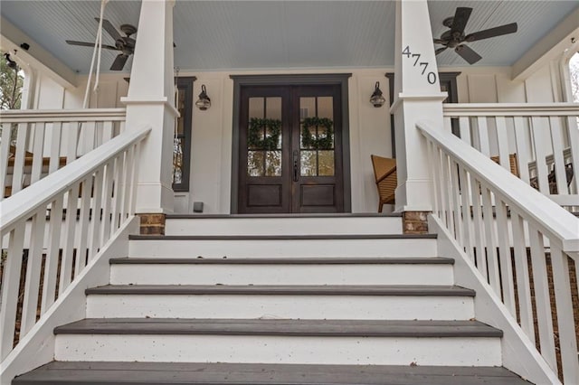 view of front of home featuring a porch, stairway, board and batten siding, and a front lawn