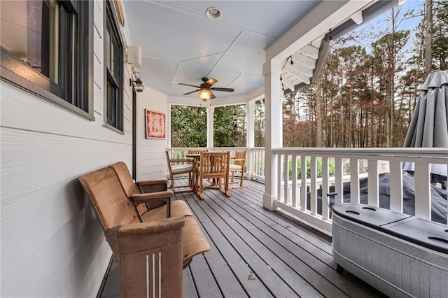 wooden terrace featuring ceiling fan