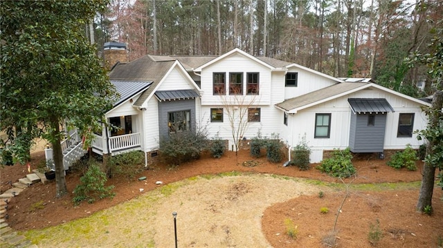 rear view of property featuring covered porch, board and batten siding, and crawl space