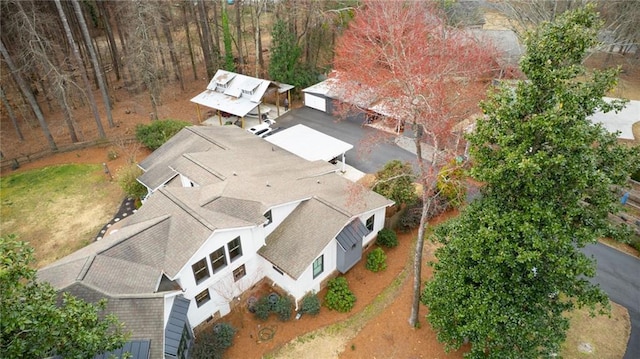 exterior space with a carport and an exterior structure