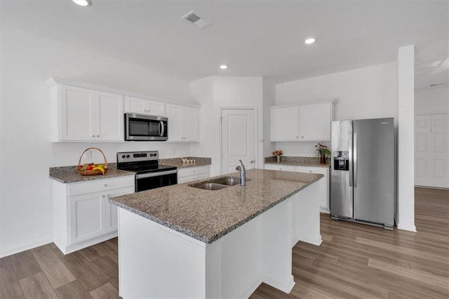 kitchen featuring sink, stainless steel appliances, and white cabinets