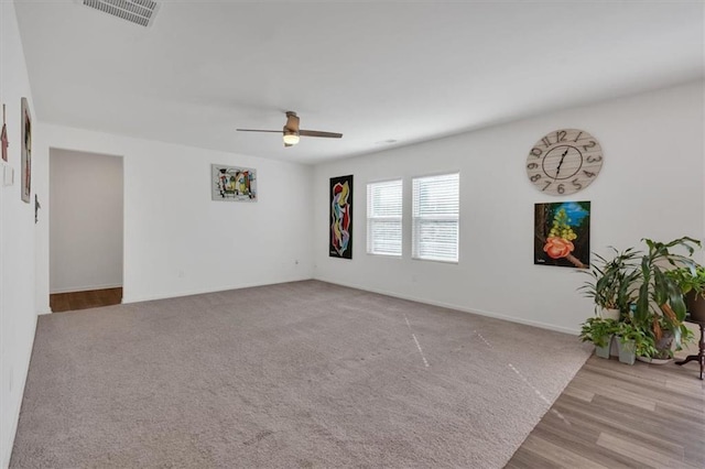 unfurnished room with ceiling fan