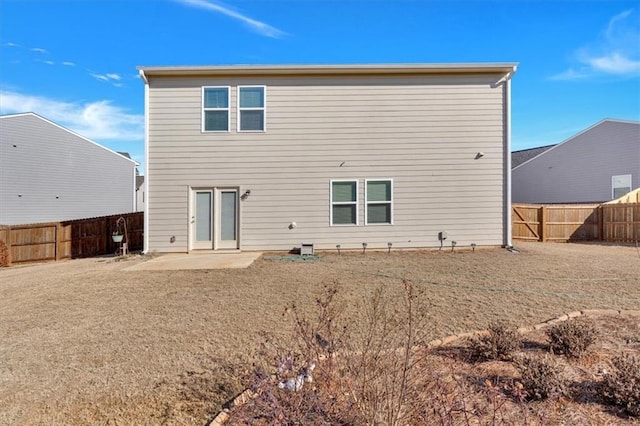 rear view of house with a patio