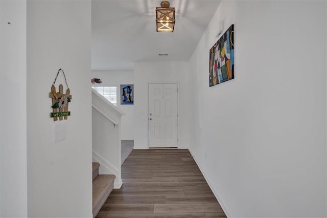 corridor with wood-type flooring