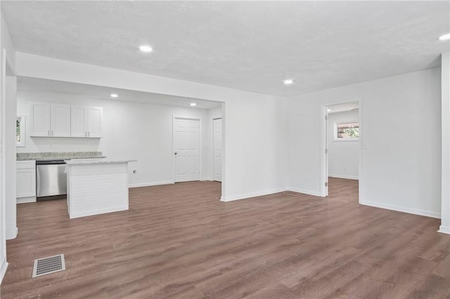 unfurnished living room featuring hardwood / wood-style floors