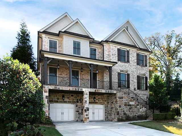 3394 Bryerstone Cir SE, Smyrna, GA 30080 - view of front of house with driveway, an attached garage, stairs, covered porch, and stone siding