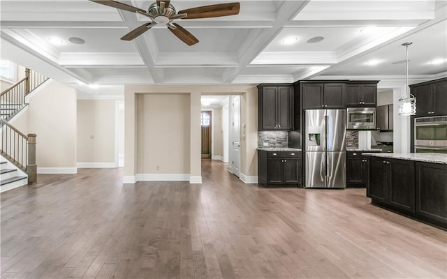 3394 Bryerstone Cir SE, Smyrna, GA 30080 - kitchen with stainless steel appliances, ceiling fan, light wood-style flooring, baseboards, and beam ceiling
