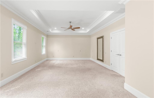 3394 Bryerstone Cir SE, Smyrna, GA 30080 - unfurnished room featuring crown molding, a ceiling fan, a tray ceiling, light carpet, and baseboards
