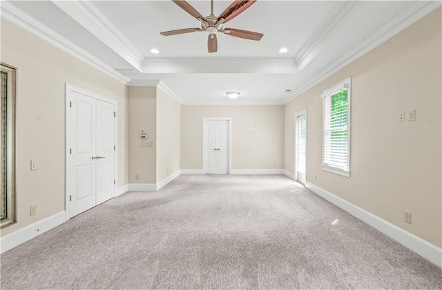 3394 Bryerstone Cir SE, Smyrna, GA 30080 - empty room featuring a raised ceiling, ornamental molding, light carpet, a ceiling fan, and baseboards