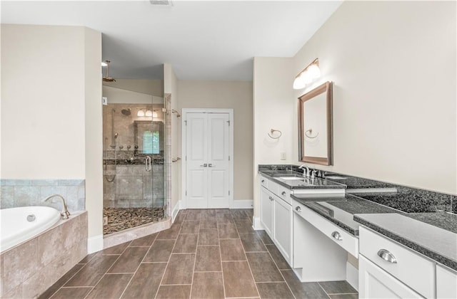 3394 Bryerstone Cir SE, Smyrna, GA 30080 - full bathroom with a stall shower, a garden tub, and vanity