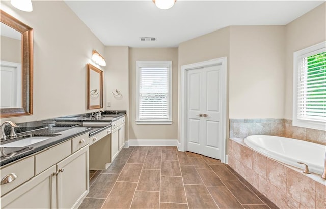 3394 Bryerstone Cir SE, Smyrna, GA 30080 - full bath with a bath, double vanity, and baseboards
