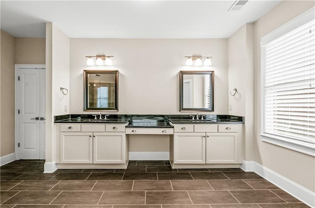 3394 Bryerstone Cir SE, Smyrna, GA 30080 - full bath featuring baseboards, double vanity, and wood finish floors