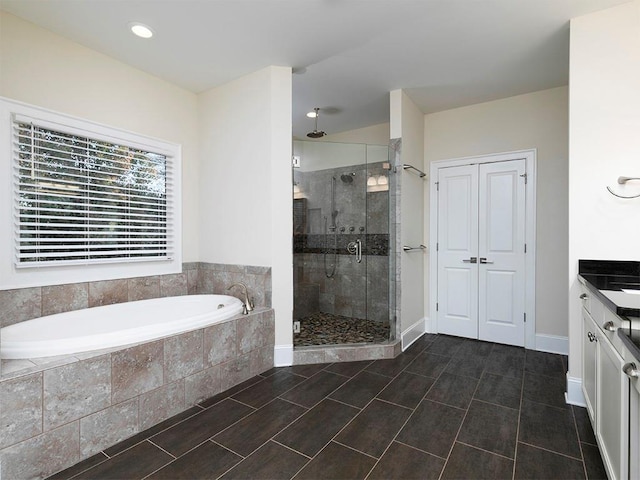 3394 Bryerstone Cir SE, Smyrna, GA 30080 - full bath featuring a garden tub, a shower stall, vanity, and recessed lighting