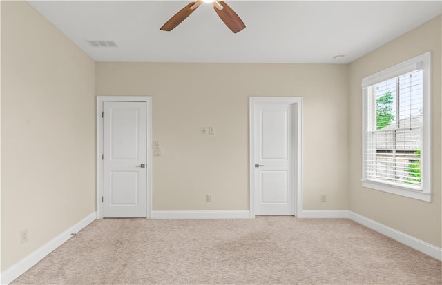 3394 Bryerstone Cir SE, Smyrna, GA 30080 - unfurnished bedroom featuring light colored carpet, baseboards, and a ceiling fan