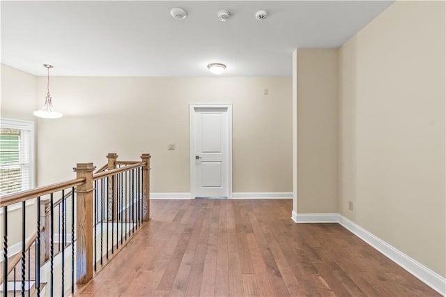 3394 Bryerstone Cir SE, Smyrna, GA 30080 - corridor featuring wood finished floors, an upstairs landing, and baseboards