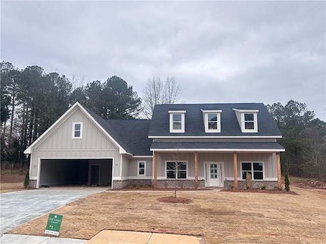 view of front of home featuring a garage and covered porch