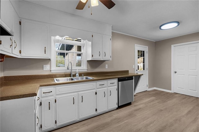 kitchen featuring white cabinetry, stainless steel dishwasher, sink, and light hardwood / wood-style flooring