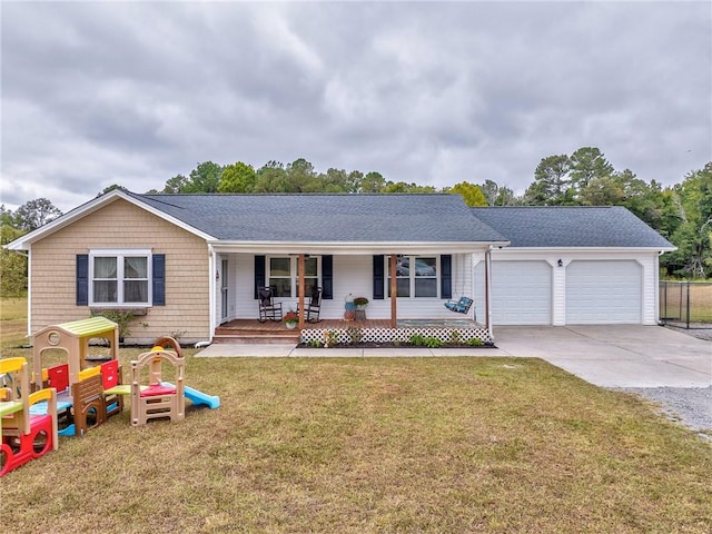 ranch-style house with a garage, a front lawn, and covered porch