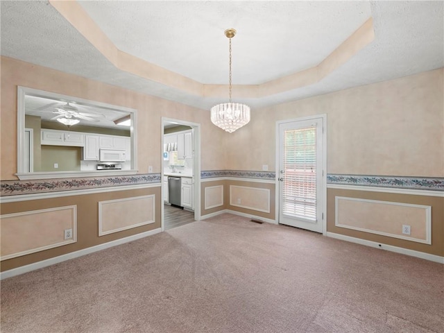 4654 Fox Forrest Dr, Flowery Branch, GA 30542 - kitchen featuring white microwave, healthy amount of natural light, dishwasher, carpet floors, and a wainscoted wall