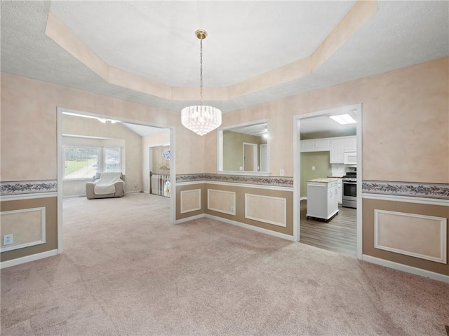 4654 Fox Forrest Dr, Flowery Branch, GA 30542 - corridor with light colored carpet, a chandelier, wainscoting, a raised ceiling, and baseboards