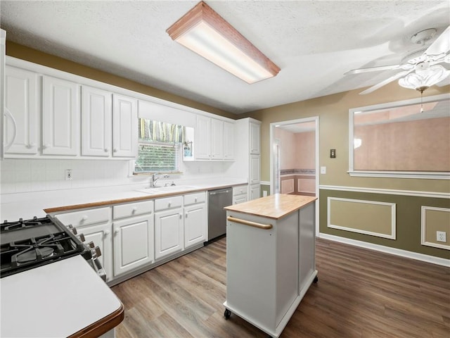 4654 Fox Forrest Dr, Flowery Branch, GA 30542 - kitchen featuring a sink, stainless steel dishwasher, wood finished floors, white cabinets, and ceiling fan