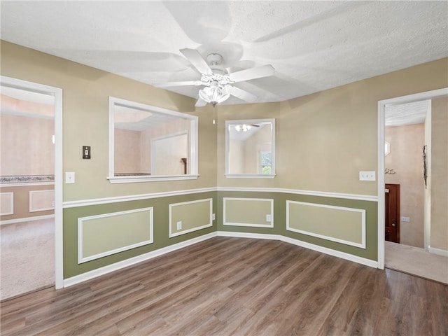 4654 Fox Forrest Dr, Flowery Branch, GA 30542 - unfurnished room with wood finished floors, a ceiling fan, and baseboards