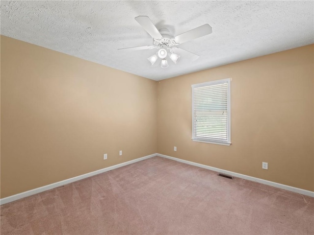 4654 Fox Forrest Dr, Flowery Branch, GA 30542 - spare room featuring light carpet, baseboards, a ceiling fan, and a textured ceiling