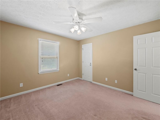 4654 Fox Forrest Dr, Flowery Branch, GA 30542 - unfurnished bedroom with light colored carpet, baseboards, a textured ceiling, and ceiling fan